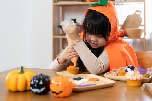 Halloween sweets, Happy child happy girl, the holiday Halloween, Happy Halloween and baking cookies.