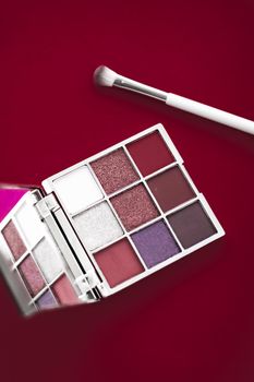 Cosmetic branding, mua and girly concept - Eyeshadow palette and make-up brush on cherry background, eye shadows cosmetics product for luxury beauty brand promotion and holiday fashion blog design