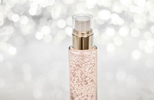 Cosmetic branding, blank label and glamour present concept - Holiday make-up base gel, serum emulsion, lotion bottle and silver glitter, luxury skin and body care cosmetics for beauty brand ads