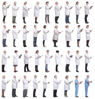 full length group of doctors with notepad isolated on white background