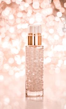 Cosmetic branding, blank label and glamour present concept - Holiday make-up base gel, serum emulsion, lotion bottle and rose gold glitter, luxury skin and body care cosmetics for beauty brand ads