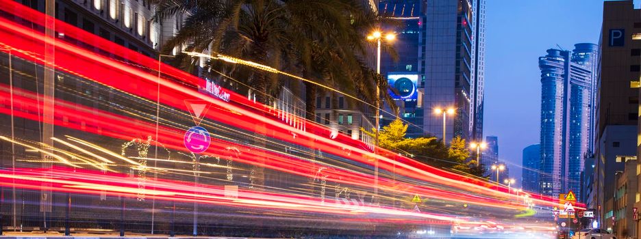 Light trails on Dubai Financial Center road. Address Sky view and Ritz Carlton hotel can be seen in the picture. Outdoors