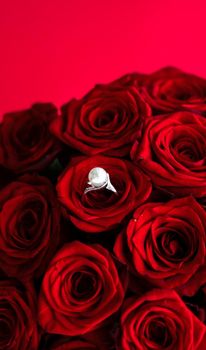 Gemstone jewellery, wedding present and engagement proposal concept - Beautiful white gold pearl ring and bouquet of red roses, luxury jewelry love gift on Valentines Day and romantic holidays