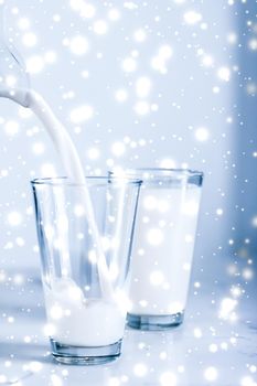 Dairy products, healthy diet and Christmas food concept - Magic holiday drink, pouring organic lactose free milk into glass on marble table