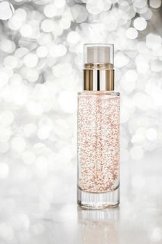 Cosmetic branding, blank label and glamour present concept - Holiday make-up base gel, serum emulsion, lotion bottle and silver glitter, luxury skin and body care cosmetics for beauty brand ads