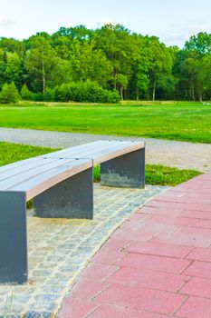 Natural beautiful panorama view with lake river walking pathway and green plants trees in the forest of Speckenbütteler Park in Lehe Bremerhaven Germany.