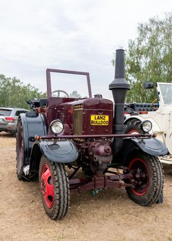 Hodonin - Panov, Czech Republic - July 20, 2022 Exhibition of historic tractors Tractor Lanz Buldog type 1937 wine colored