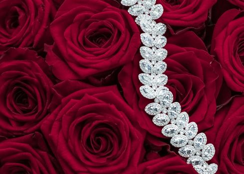 Luxe branding, glamour fashion and boutique shopping concept - Luxury diamond jewelry bracelet and red roses flowers, love gift on Valentines Day and jewellery brand holiday background design