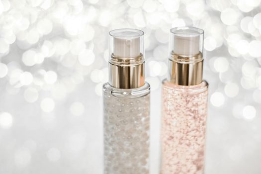 Cosmetic branding, blank label and glamour present concept - Holiday make-up base gel, serum emulsion, lotion bottle and silver glitter, luxury skin and body care cosmetics for beauty brand ads