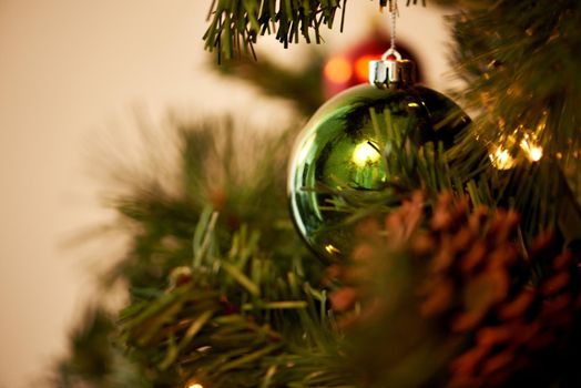 Let the festivities begin. Closeup shot of Christmas decorations on a tree