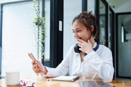 Portrait of a teenage girl using her phone to make video calls or call friends