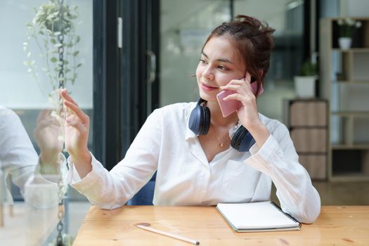 Portrait of a teenage girl using her phone to make video calls or call friends