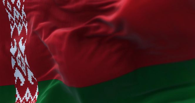 Close-up view of the belarusian national flag waving in the wind. The Republic of Belarus is a landlocked country in Eastern Europe. Fabric textured background. Selective focus