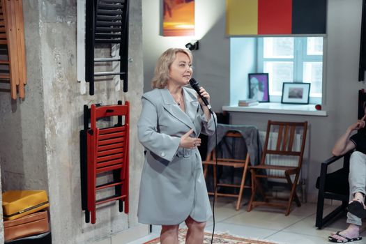 young woman at a public speaking training. business and education.