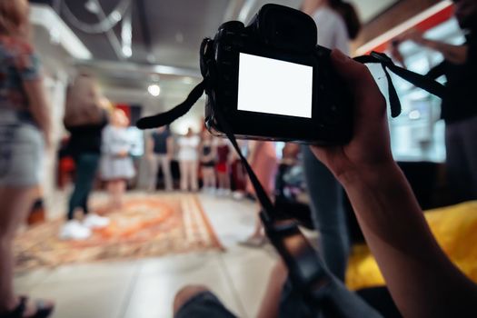 close-up. cameraman with a camera works in a business training class. business and education.