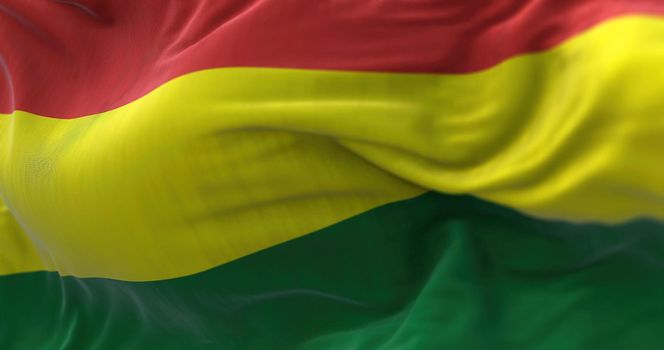 Close-up view of the Bolivia national flag waving in the wind. The Plurinational State of Bolivia is a country located in western-central South America. Fabric textured background. Selective focus