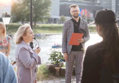 cropped image of a group of tourists walking through the city . close-up.