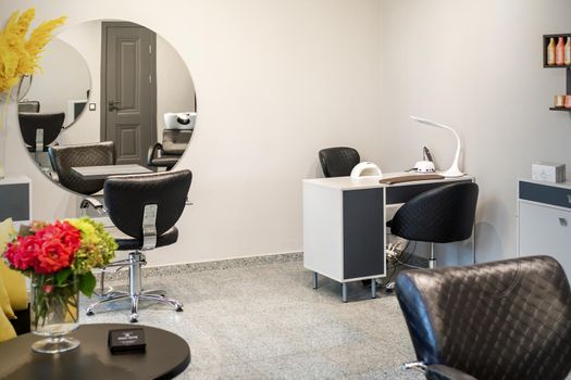 Interior of modern bright hair salon, manicure salon, or beauty salon