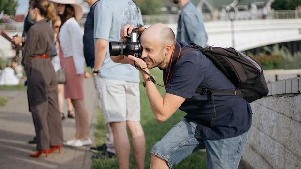 young man with a camera taking a photo during an excursion. close-up .