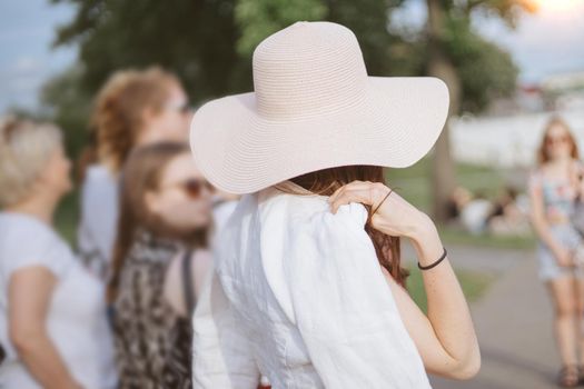 image of a group of tourists on a city tour . rear view.