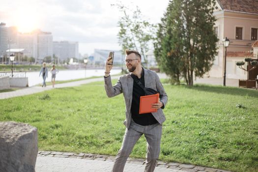 young male tourist taking a selfie during an excursion.