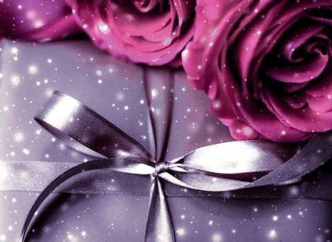 Luxurious design, shop sale promotion and happy surprise concept - Luxury holiday silver gift box and pink roses as Christmas, Valentines Day or birthday present