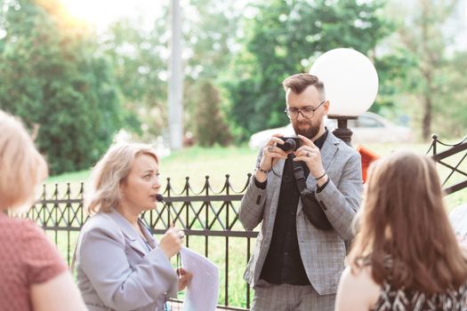 male tourist is viewing a photo on his camera. close-up.