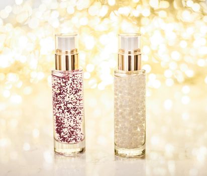 Cosmetic branding, blank label and glamour present concept - Holiday make-up base gel, serum emulsion, lotion bottle and golden glitter, luxury skin and body care cosmetics for beauty brand ads