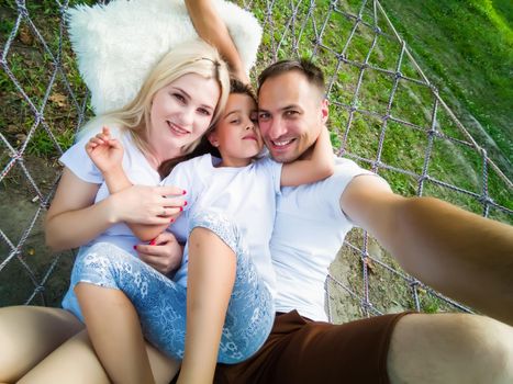 Portrait of family in a hammock