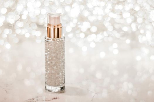 Cosmetic branding, blank label and glamour present concept - Holiday make-up base gel, serum emulsion, lotion bottle and silver glitter, luxury skin and body care cosmetics for beauty brand ads