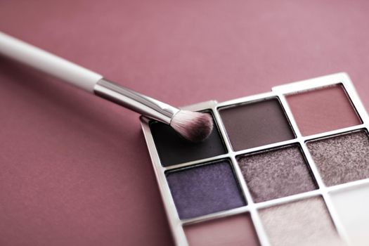 Cosmetic branding, mua and girly concept - Eyeshadow palette and make-up brush on rouge background, eye shadows cosmetics product for luxury beauty brand promotion and holiday fashion blog design