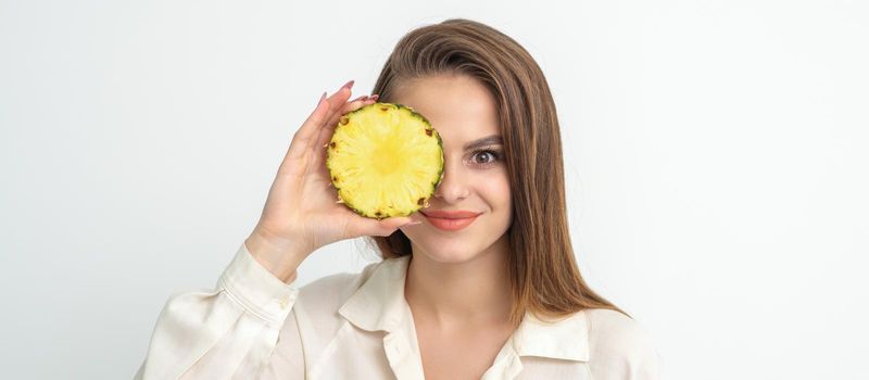 Attractive pretty nice young caucasian woman hold sliced pineapple covering her eye isolated on white color background