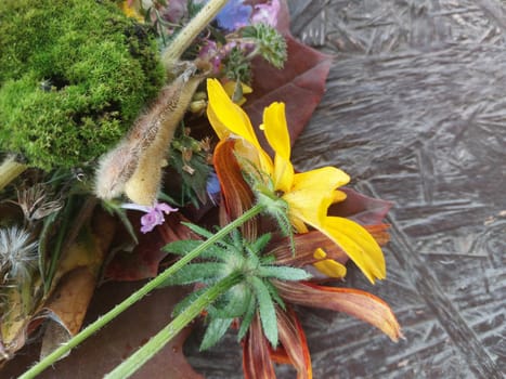 Autumn colorful flowers lie on a the table