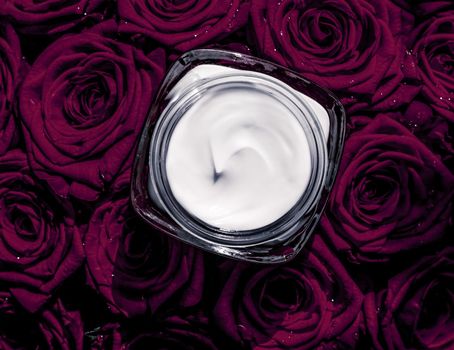 Luxe cosmetics, branding and anti-age concept - Face cream skin moisturizer and dark purple roses, luxury skincare cosmetic product on floral background as beauty brand holiday flatlay design