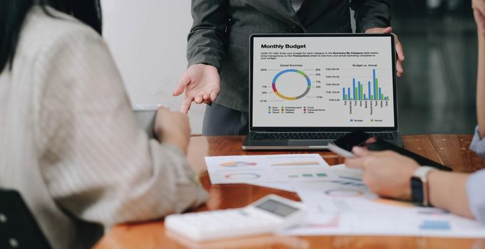 Close up asian business adviser meeting to analyze and discuss the situation on the financial report in the meeting room.Investment Consultant, Financial advisor and accounting concept.