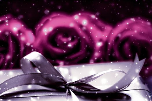 Luxurious design, shop sale promotion and happy surprise concept - Luxury holiday silver gift box and pink roses as Christmas, Valentines Day or birthday present