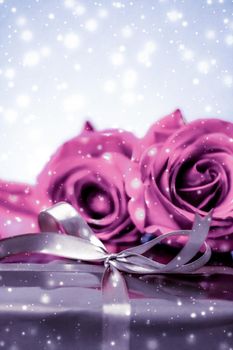 Luxurious design, shop sale promotion and happy surprise concept - Luxury holiday silver gift box and pink roses as Christmas, Valentines Day or birthday present