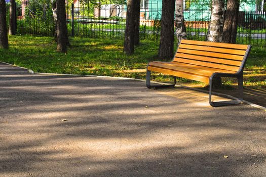 City park with paths and benches. Place for rest and walks. urban architecture