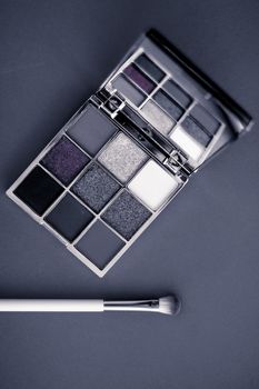 Cosmetic branding, mua and girly concept - Eyeshadow palette and make-up brush on graphite background, eye shadows cosmetics product for luxury beauty brand promotion and holiday fashion blog design