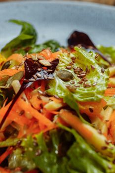 Sicilian salad with fennel, oranges, grapefruit and radicchio salad with balsamic dressing on a blue linen tablecloth. healthy summer italian food.