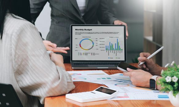 Close up asian business adviser meeting to analyze and discuss the situation on the financial report in the meeting room.Investment Consultant, Financial advisor and accounting concept.
