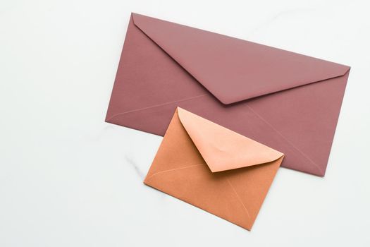 Postal service, newsletter and greeting card concept - Blank paper envelopes on marble flatlay background, holiday mail letter or post card message design