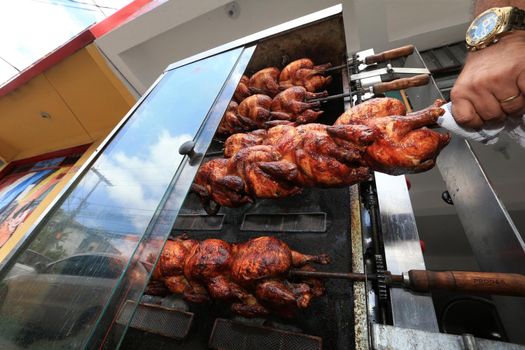 salvador, bahia, brazil - september 17, 2022: Roast chicken at a street restaurant in Salvador city.