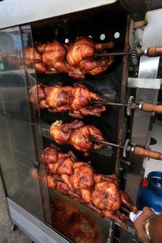 salvador, bahia, brazil - september 17, 2022: Roast chicken at a street restaurant in Salvador city.