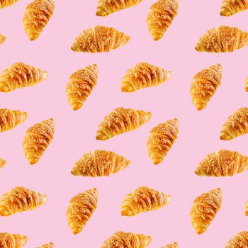 seamless pattern made from Fresh croissant isolated on pink background. Bakery pattern with baked croissant with cheese.
