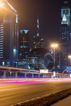 Dubai,UAE - 05.18.2021 Main road of a United Arab Emirates, Shekh Zayed road.Many of famous buildings can be seen as well as metro station and Museum of future.