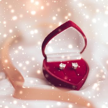 Timeless luxury, romantic proposal and happy celebration concept - Diamond earrings in a heart shaped jewellery gift box, love present for Christmas, New Years Eve, Valentines Day and winter holidays