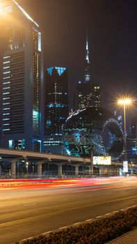 Dubai,UAE - 05.18.2021 Main road of a United Arab Emirates, Shekh Zayed road.Many of famous buildings can be seen as well as metro station and Museum of future.