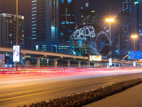 Dubai,UAE - 05.18.2021 Main road of a United Arab Emirates, Shekh Zayed road.Many of famous buildings can be seen as well as metro station and Museum of future.