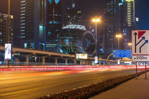 Dubai,UAE - 05.18.2021 Main road of a United Arab Emirates, Shekh Zayed road.Many of famous buildings can be seen as well as metro station and Museum of future.